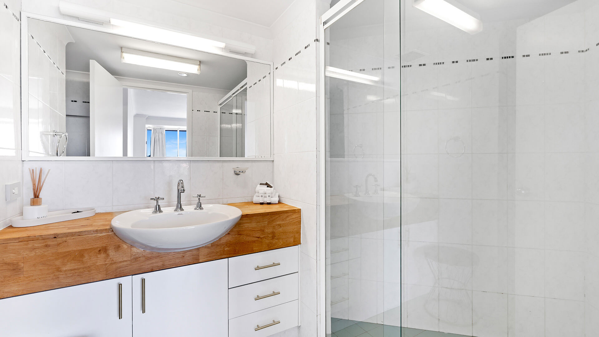 Modern bathroom in the 2 Bedroom Pool View Apartment at ULTIQA Points North with large shower and vanity.