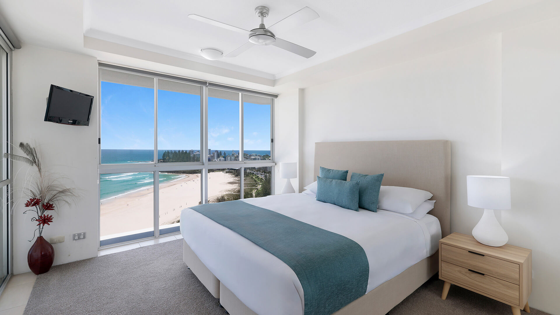 Master bedroom in the Deluxe 2 Bedroom Centre Front Apartment at ULTIQA Points North with sweeping beachfront views.