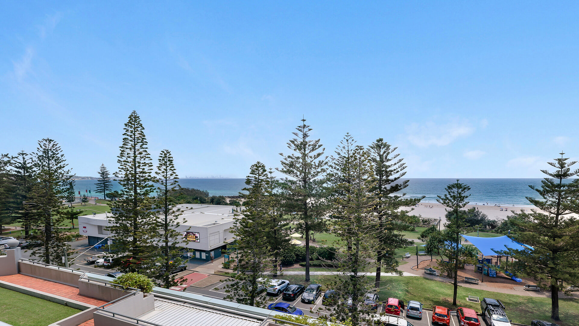 Oceanfront view from the Standard 2 Bedroom Centre Front Apartment at ULTIQA Points North, overlooking parklands and Coolangatta Beach.