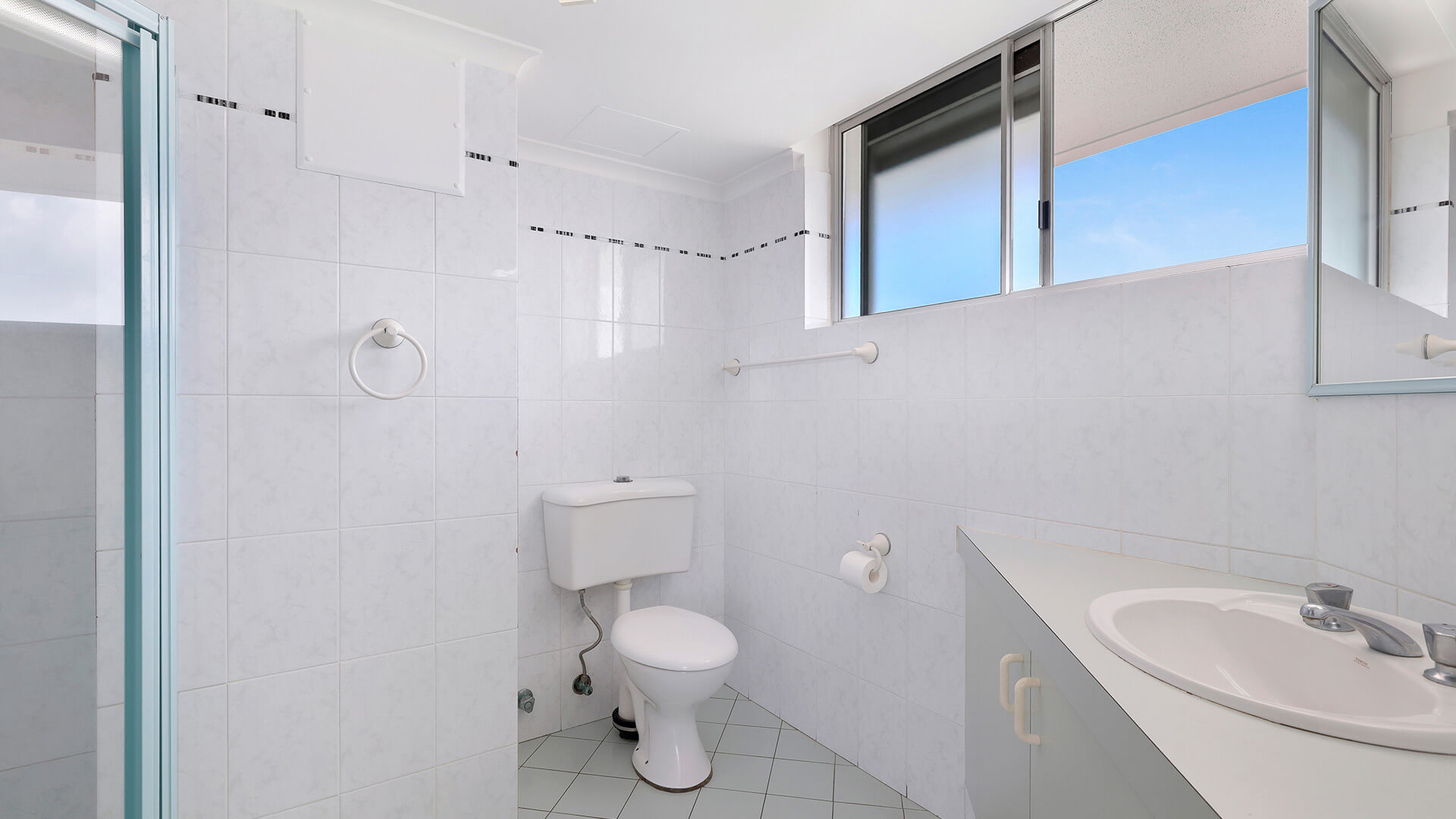 Bathroom in the Standard 2 Bedroom Ocean View Apartment at ULTIQA Points North, featuring a shower and vanity.