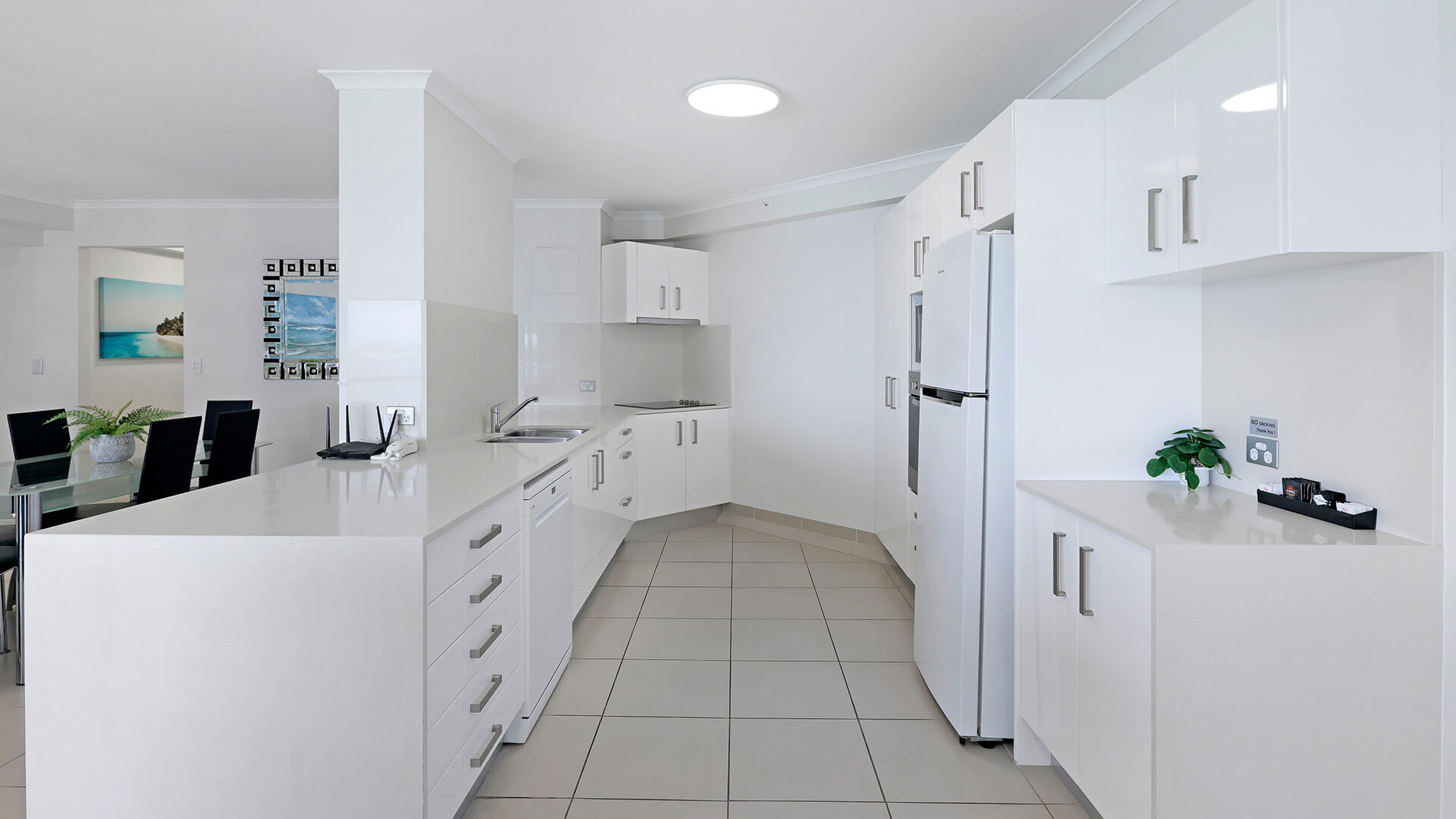 Modern spacious kitchen and dining area in the Superior 1 Bedroom Ocean View Apartment at ULTIQA Points North.