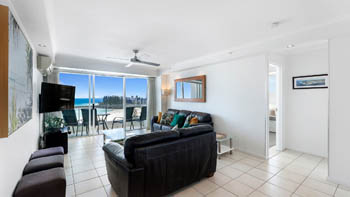 Spacious oceanfront lounge area with furnished patio & Ocean Views in the Superior 1 Bedroom Ocean View Apartment at ULTIQA Points North.