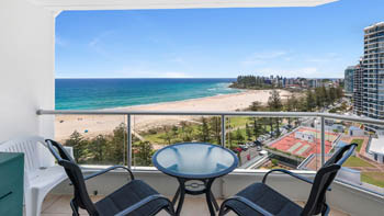 Beachfront balcony overlooking Coolangatta Beach in the Superior 1 Bedroom Ocean View Apartment at ULTIQA Points North.