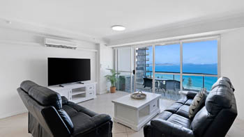Spacious oceanfront lounge area with furnished patio & Ocean Views in the Superior 1 Bedroom Ocean View Apartment at ULTIQA Points North.